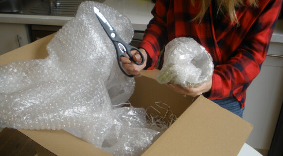 A woman unboxing her parcel