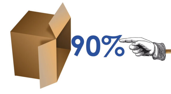a hand pushing 90 percent inside a cardboard box